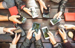 group of people holding their phones