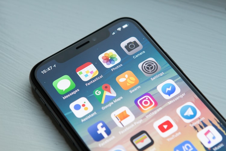 black iphone displaying social media applications