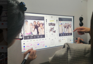 Teenagers enjoying on Purikura or print club- a photo booth