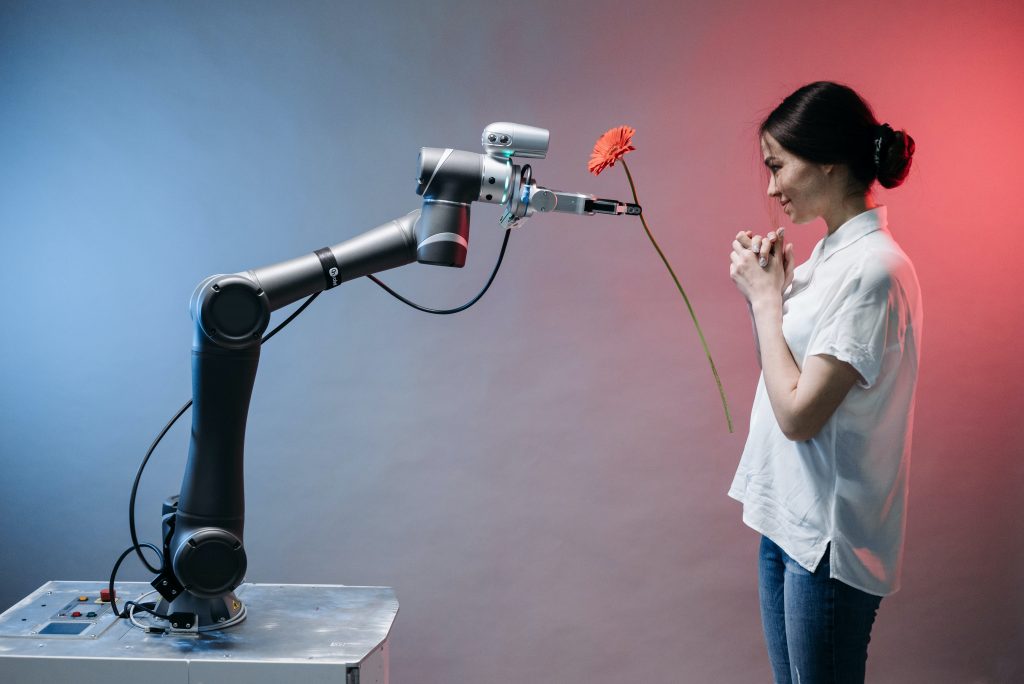 artificial intelligence robot giving flower to the lady